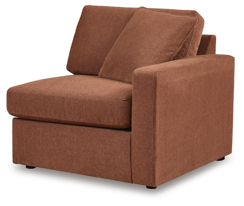 Ashley Furniture Modmax balanced sectional sofa with built-in audio and storage consoles, shown from an angled view.