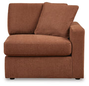 Ashley Furniture Modmax sectional with built-in audio, storage consoles, and modern design, shown from a head-on angle.