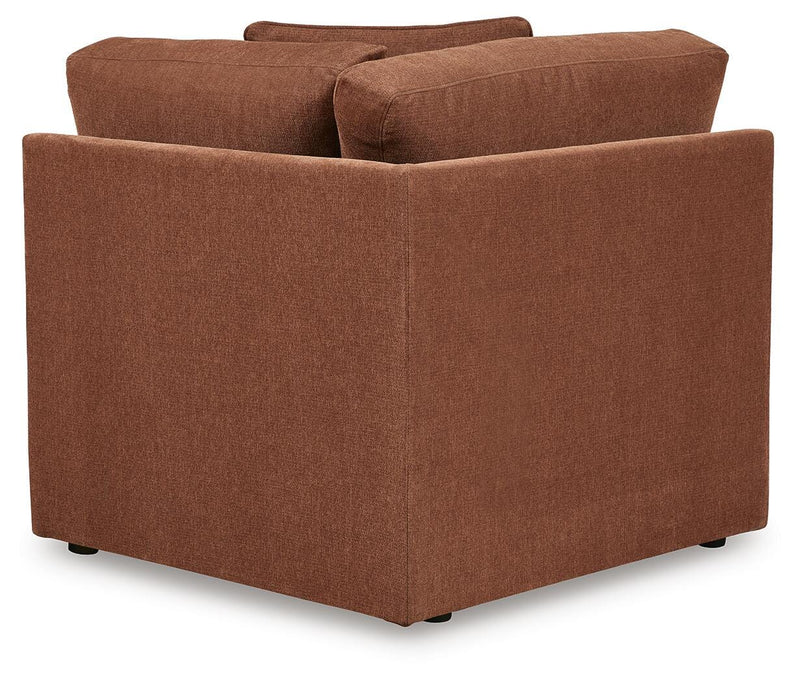 Ashley Furniture Modmax sectional sofa with built-in audio and storage consoles, showing the back view with plush cushions and modern design.