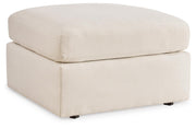 Ashley Furniture Modmax living room set with sofa and armchair in a modern design, shown from an angled side view.