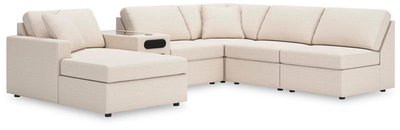 Ashley Furniture Modmax sectional with chaise, featuring modern fabric upholstery and a spacious seating arrangement.