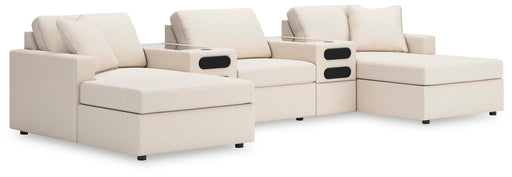 Ashley Furniture Modmax double sectional chaise with integrated audio consoles, featuring plush cushions and modern design.