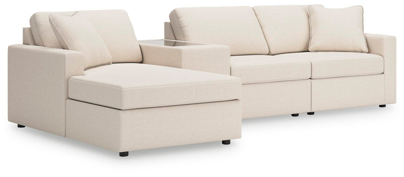 Ashley Furniture Modmax sectional with chaise, featuring plush cushions and modern design in a neutral fabric.
