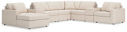 Ashley Furniture Modmax sectional with chaise, featuring modern upholstery and plush cushions in a stylish living room setting.