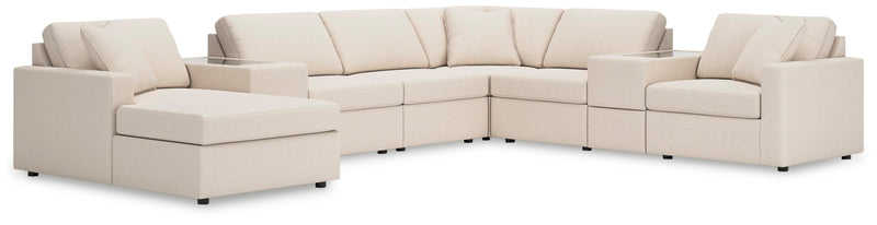 Ashley Furniture Modmax sectional with chaise, featuring modern upholstery and plush cushions in a stylish living room setting.