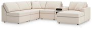 Ashley Furniture Modmax sectional with chaise, featuring plush cushions and modern design in a spacious living room setting.