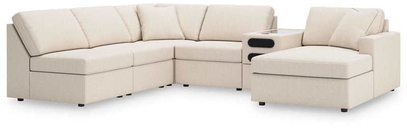 Ashley Furniture Modmax sectional with chaise, featuring plush cushions and modern design in a spacious living room setting.