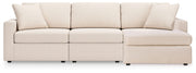 Ashley Furniture Modmax sectional with chaise, tan fabric, with plush cushions and modern design, head-on view.