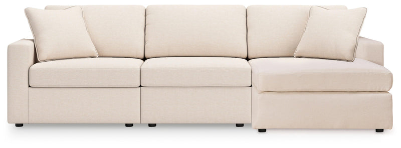 Ashley Furniture Modmax sectional with chaise, tan fabric, with plush cushions and modern design, head-on view.
