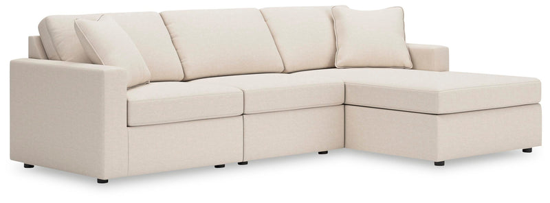 Ashley Furniture Modmax sectional with chaise, featuring modern upholstery and plush cushions, shown in a stylish living room setting.