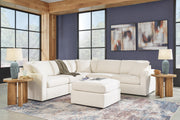 Ashley Furniture Modmax living room set featuring a sofa, armchair, and coffee table in a modern design with neutral upholstery.