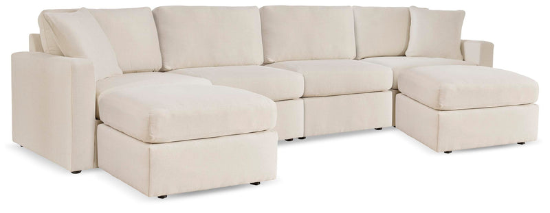 Ashley Furniture Modmax living room set with sofa and armchair in a modern design, featuring neutral upholstery and sleek style.