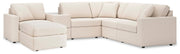 Ashley Furniture Modmax living room set featuring a sofa and matching armchair in a modern design with neutral upholstery.