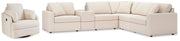 Ashley Furniture Modmax living room set with sofa, loveseat, and coffee table in a modern design, shown in a stylish living space.