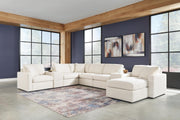 Ashley Furniture Modmax Living Room Set with sofa and matching armchair in a modern design, shown in a cozy living space.