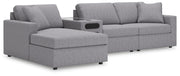 Ashley Furniture Modmax sectional with chaise, featuring modern design, plush cushions, and neutral fabric upholstery.