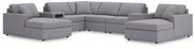 Ashley Furniture Modmax sectional with chaise, featuring plush cushions and modern design, shown in a stylish living room setting.