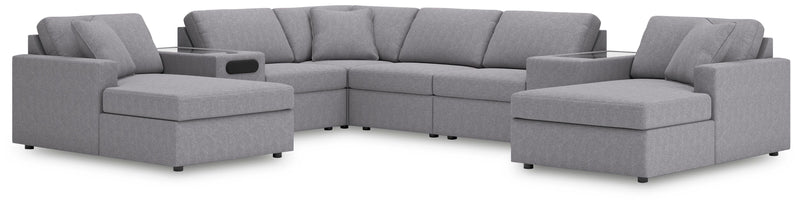 Ashley Furniture Modmax sectional with chaise, featuring plush cushions and modern design, shown in a stylish living room setting.