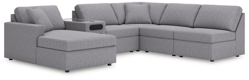 Ashley Furniture Modmax sectional with chaise, featuring modern design, plush cushions, and fabric upholstery in a stylish living room setting.