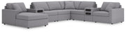 Ashley Furniture Modmax sectional with integrated audio system and chaise, featuring plush fabric and modern design.
