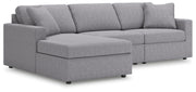 Ashley Furniture Modmax sectional with chaise, showing the modern fabric upholstery, clean lines, and spacious seating arrangement.
