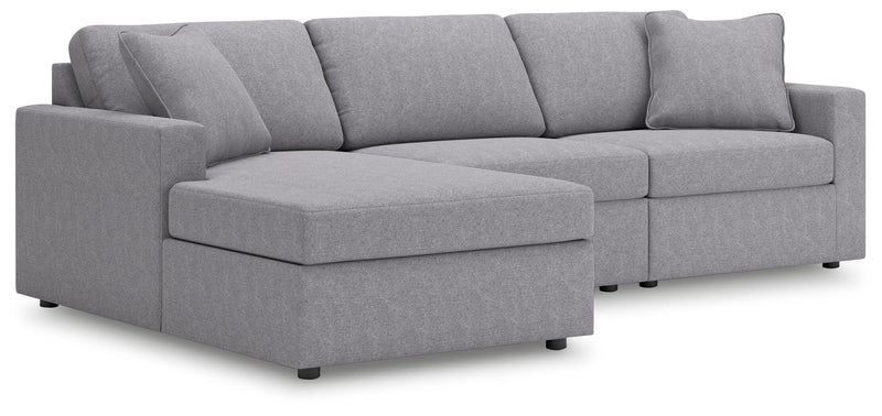 Ashley Furniture Modmax sectional with chaise, showing the modern fabric upholstery, clean lines, and spacious seating arrangement.