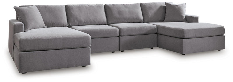 Ashley Furniture Modmax sectional with chaise, featuring plush upholstery and modern design in a stylish living room setting.