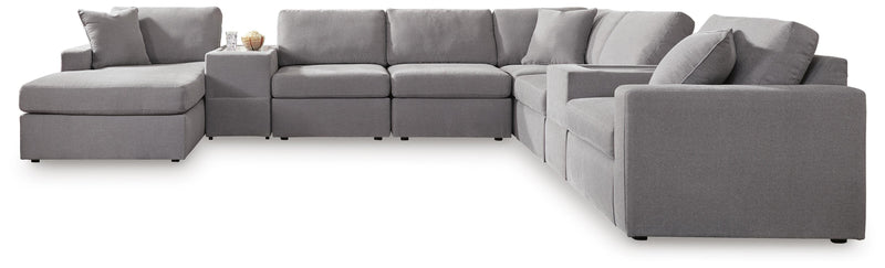 Ashley Furniture Modmax sectional with chaise, featuring plush fabric, modern design, and multiple cushions for comfortable seating.