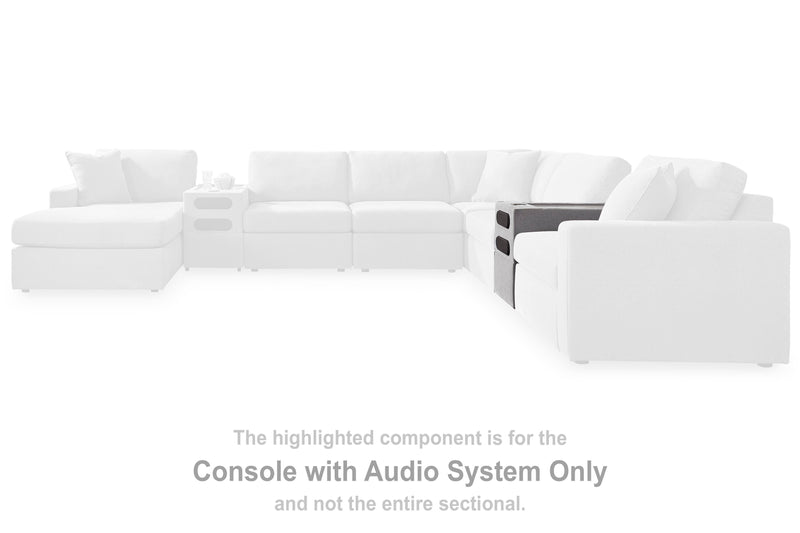 Ashley Furniture Modmax sectional sofa with built-in audio, storage consoles, and modern design, shown in a stylish living room setting.