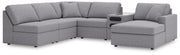Ashley Furniture Modmax sectional with chaise, featuring modern design and plush cushions in a stylish living room setting.