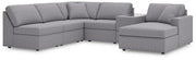 Ashley Furniture Modmax sectional with chaise, featuring modern design and plush seating in a stylish living room setting.