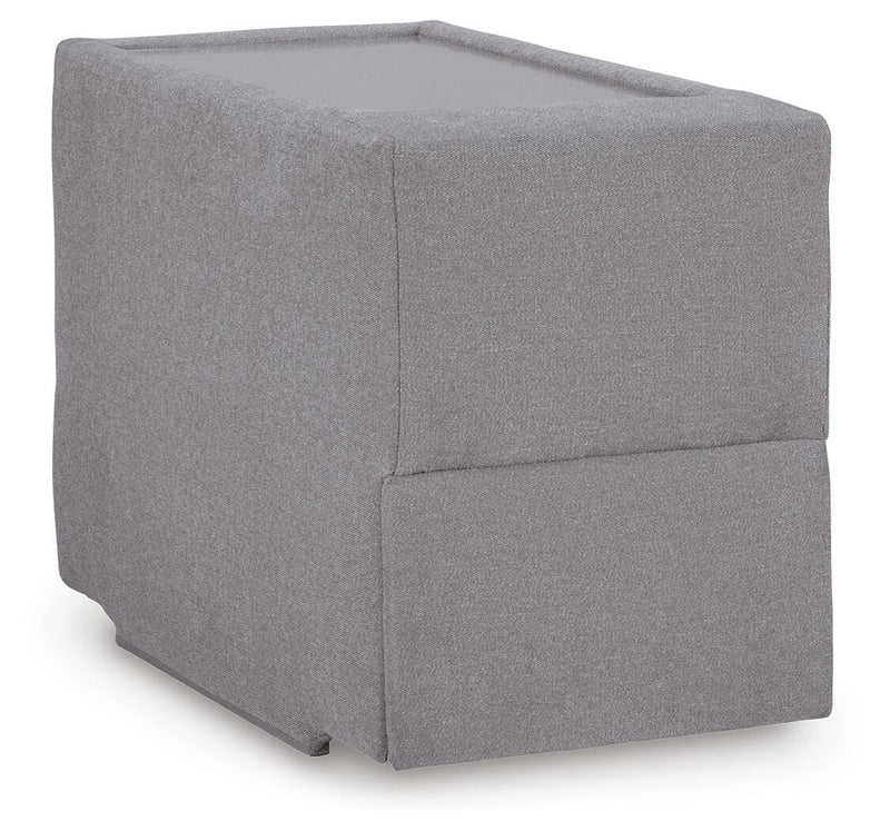 Ashley Furniture Modmax sectional with built-in audio, storage consoles, and a modern design, viewed from an angled close-up.