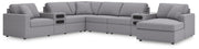 Ashley Furniture Modmax sectional with integrated audio system and chaise, featuring modern design and plush upholstery.