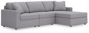 Ashley Furniture Modmax sectional with chaise, showing modern upholstered sectional sofa with chaise lounge in a living room setting.