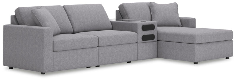 Ashley Furniture Modmax sectional with chaise, featuring plush fabric upholstery and modern design in a spacious living room setting.