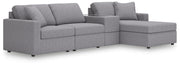 Ashley Furniture Modmax sectional with chaise, showing a modern L-shaped sofa with plush cushions and fabric upholstery.