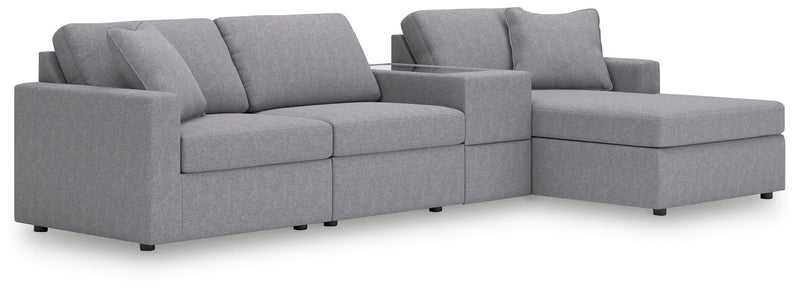 Ashley Furniture Modmax sectional with chaise, showing a modern L-shaped sofa with plush cushions and fabric upholstery.