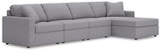 Ashley Furniture Modmax sectional with chaise, showing modern fabric upholstery and spacious seating arrangement.