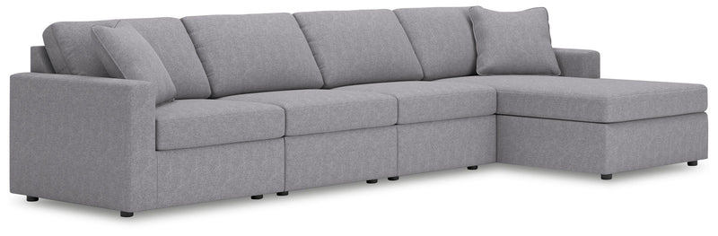 Ashley Furniture Modmax sectional with chaise, showing modern fabric upholstery and spacious seating arrangement.