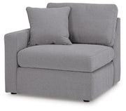 Ashley Furniture Modmax sectional with built-in audio, storage consoles, and modern design, shown from an angled view.