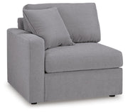 Ashley Furniture Modmax sectional with built-in audio and storage consoles, shown from an angled view in a modern living room setting.