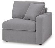 Ashley Furniture Modmax sectional with built-in audio, storage consoles, and modern design, shown from an angled view.