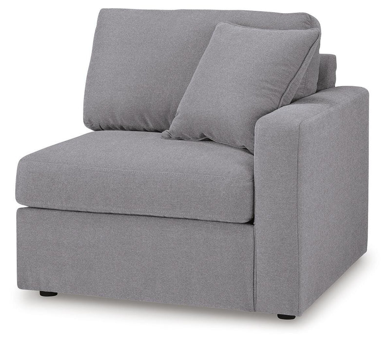 Ashley Furniture Modmax sectional with built-in audio, storage consoles, and modern design, shown from an angled view.