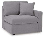 Ashley Furniture Modmax balanced sectional with built-in audio and storage consoles, shown from an angled view in the image.