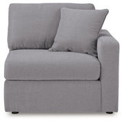 Ashley Furniture Modmax sectional with built-in audio and storage consoles, showing its modern design and plush seating.