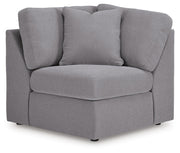 Ashley Furniture Modmax balanced sectional with built-in audio and storage consoles, featuring plush cushions and modern design.