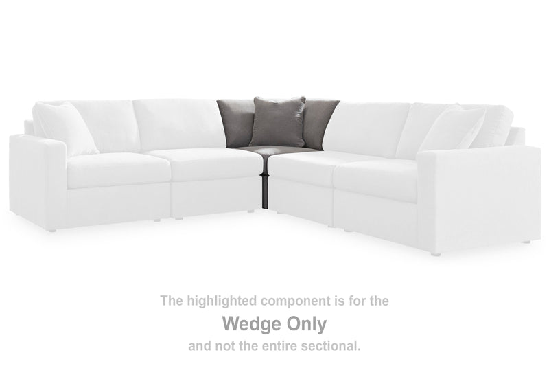 Ashley Furniture Modmax sectional with built-in audio system and storage consoles, featuring a modern, balanced design in neutral upholstery.