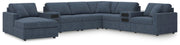 Ashley Furniture Modmax sectional with built-in audio system and chaise, featuring plush fabric and modern design.