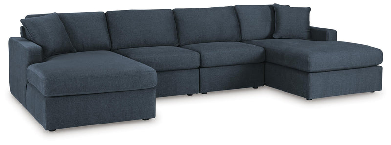 Ashley Furniture Modmax sectional with chaise, featuring plush cushions and modern design in a stylish living room setting.