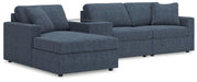 Ashley Furniture Modmax sectional with chaise, featuring modern design, neutral upholstery, and plush cushions.